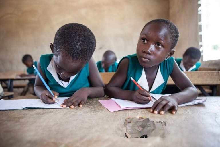 Children writing in class